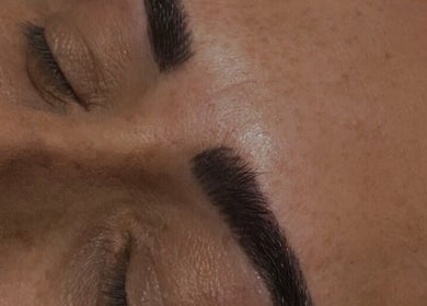 Close-up of expertly shaped eyebrows at Glammed By Loz, Ellesmere Port, England, GB.