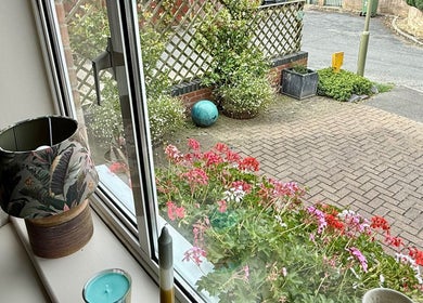 View from Katherapyuk's window with vibrant flowers in Crowmarsh Gifford, England, GB.