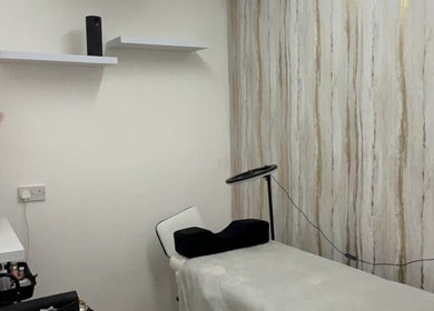 Cozy beauty treatment room at pblashess in Corby, England, GB with a treatment bed and elegant decor.