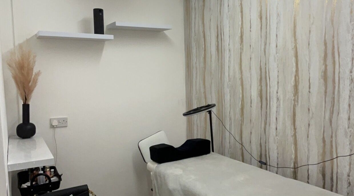 Cozy beauty treatment room at pblashess in Corby, England, GB with a treatment bed and elegant decor.