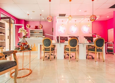 Elegant interior of Harmony Nail and Beauty Irene, Centurion, Gauteng, ZA with modern pink décor and comfortable seating.