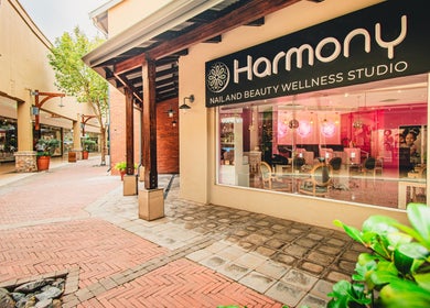 Entrance of Harmony Nail and Beauty Irene at Centurion, Gauteng, ZA with pink interior view.
