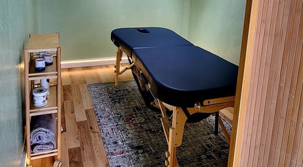 Massage table at Spiritfit Massage, Penryn, England, GB, showcasing a calming wellness environment.