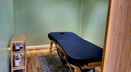 Calming massage room at Spiritfit Massage, Penryn, England, GB with soothing decor and a treatment table.