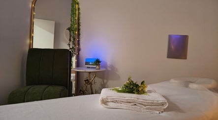 Relaxing massage room at Massage by Laura, Runaway Bay, Queensland, AU with soft lighting and fresh linens.