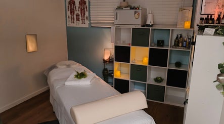 Relaxing massage room at Massage by Laura, Runaway Bay, Queensland, AU, featuring calming decor.