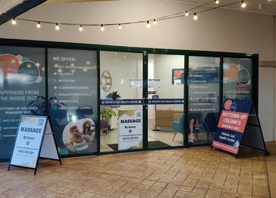 Entrance of Massage by Laura, Runaway Bay, Queensland, AU with signage for holistic health services.
