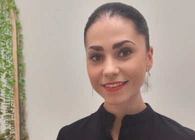 Friendly therapist at Massage by Laura, Runaway Bay, Queensland, AU, radiating calm and expertise.