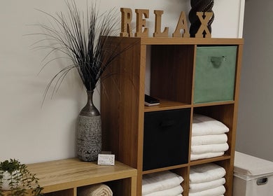 Serene relaxation space at Massage by Laura with towels and decor in Runaway Bay, Queensland, AU.