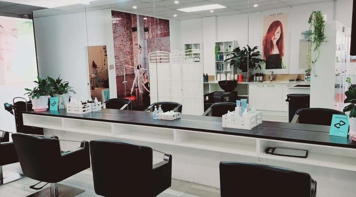 Interior of Hairmakeover Clendon in Auckland, Auckland, NZ, featuring sleek styling chairs and modern decor.