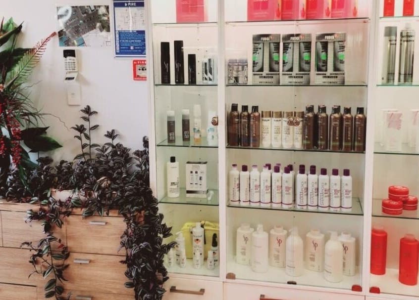 Hair products and lush plant at Hairmakeover Clendon, Auckland, Auckland, NZ. Chic and inviting atmosphere.