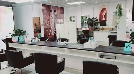 Modern interior of Hairmakeover Manurewa in Auckland, Auckland, NZ with mirrors and styling chairs.