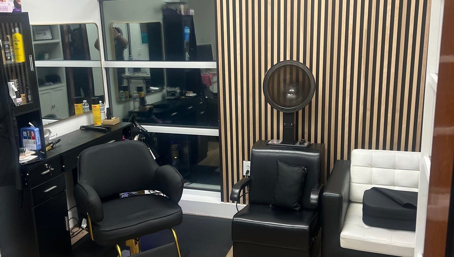 Modern salon chair at Treasuring Your Crown- Natural Hair in Charlotte, North Carolina, US, enhancing client comfort.
