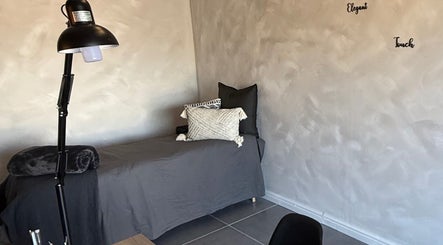 Cozy massage bed at Elegant Touch Beauty in Gqeberha, Eastern Cape, ZA for soothing wellness treatments.