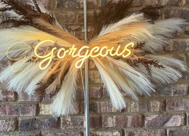 Elegant Touch Beauty in Gqeberha, Eastern Cape, ZA, featuring a gorgeous neon sign with pampas grass decor.