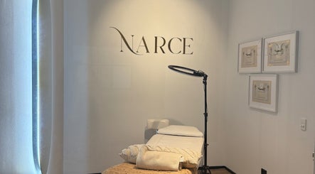 Serene spa room at Narce, West End, Queensland, AU featuring a massage table and ambient lighting.