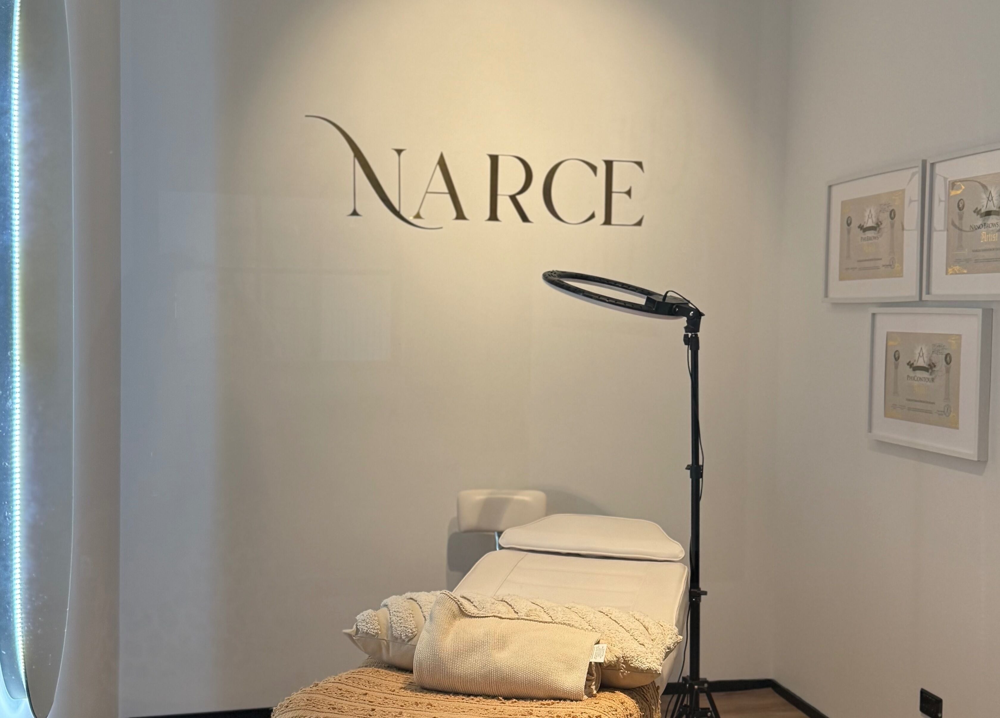 Narce spa treatment room in West End, Queensland, AU, featuring a comfortable bed and soothing ambiance.