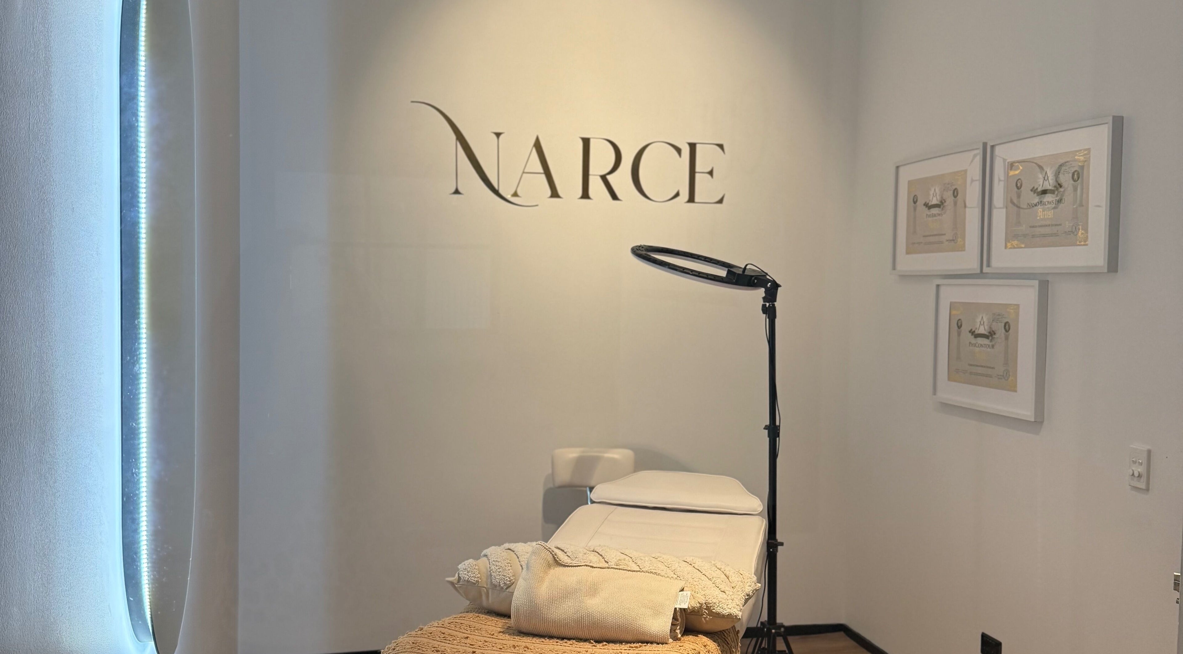 Narce spa treatment room in West End, Queensland, AU, featuring a comfortable bed and soothing ambiance.