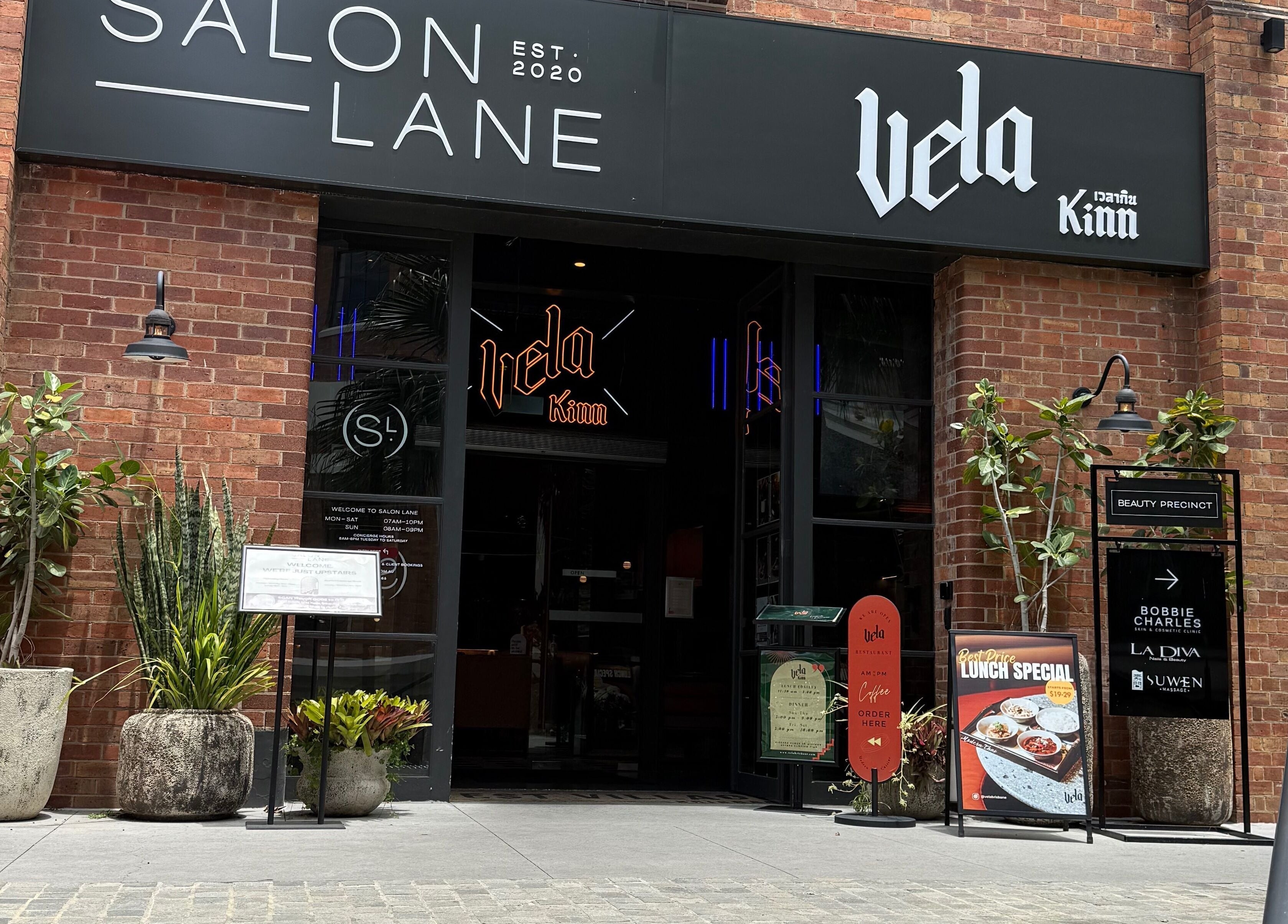 Exterior of Narce beauty venue at West End, Queensland, AU with welcoming entrance and potted plants.