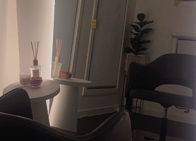 Elegant seating area at JH EXTENSIONS in Melbourne, Victoria, AU with ambient lighting and decor.