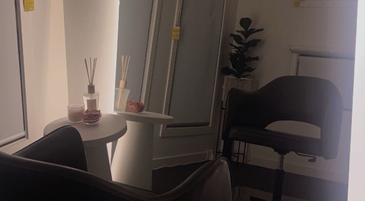 Chic seating area at JH HAIR EXTENSIONS, Melbourne, Victoria, AU with stylish decor elements.