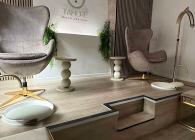 Elegant pedicure chairs at Tamoré Beauty in Birmingham, England, GB, offering a serene wellness experience.