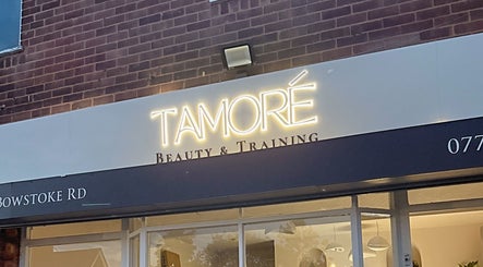 Tamoré Beauty storefront signage in Birmingham, England, GB showcasing elegant lighting.