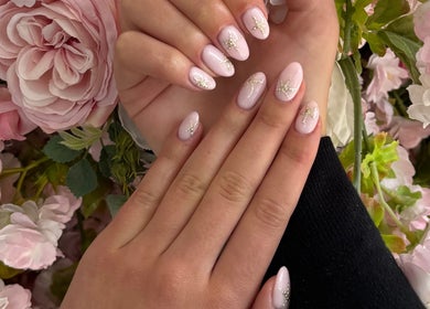 Beautiful floral nail art displayed at Esel Beauty, Enfield, England, GB showcasing intricate pink designs.