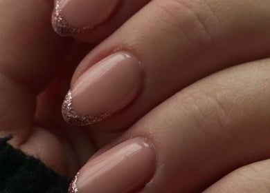 Elegant nude nails with glitter tips at Esel Beauty, Enfield, England, GB showcase refined style and expert manicure.
