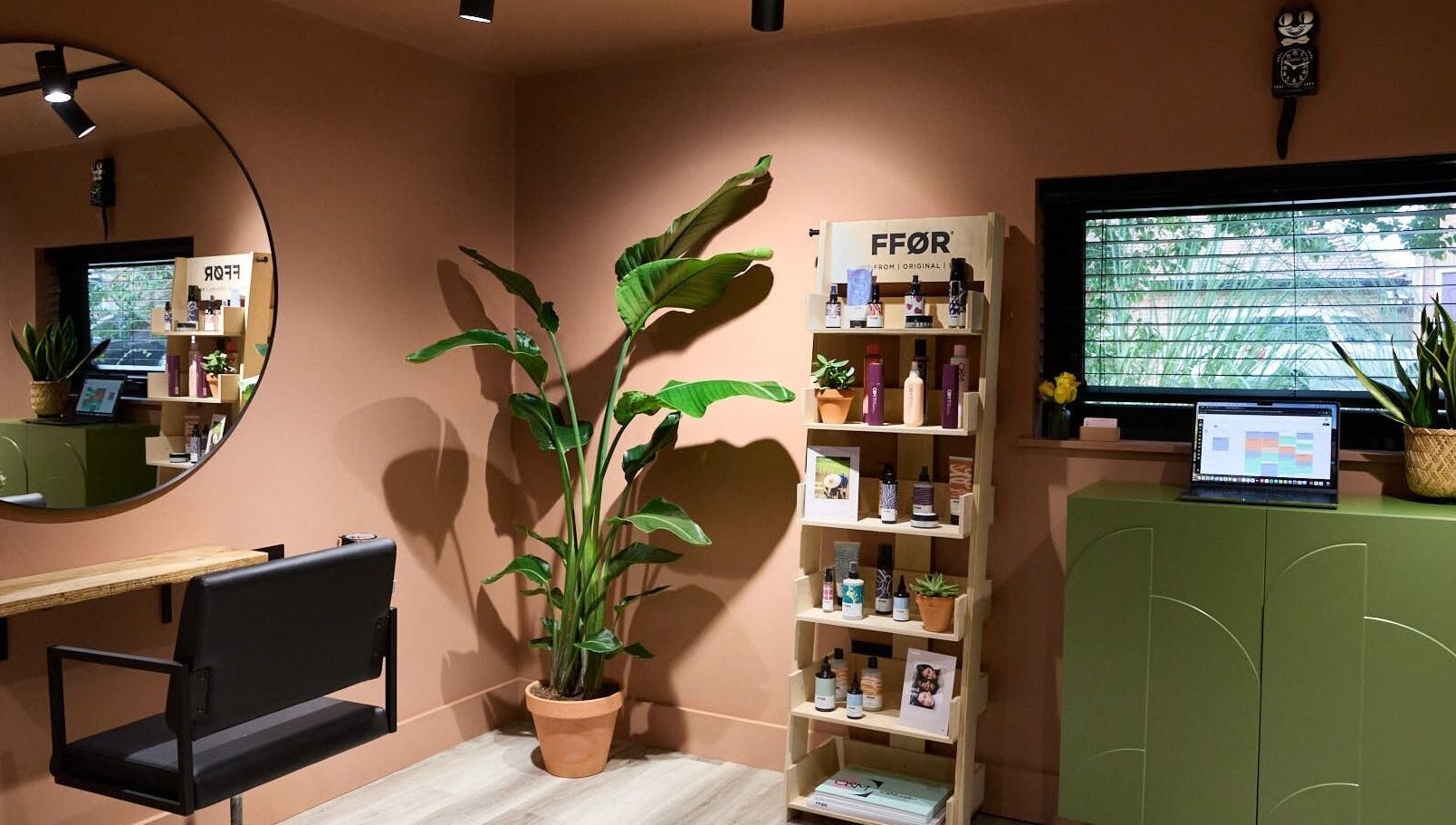 Modern styling corner at Hoipolloi Studio in Winchester, England, GB with plants and minimal decor.