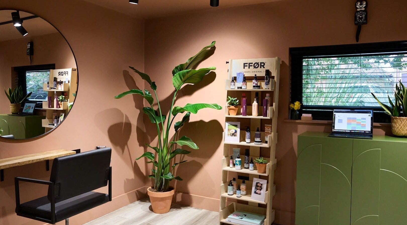 Modern styling corner at Hoipolloi Studio in Winchester, England, GB with plants and minimal decor.