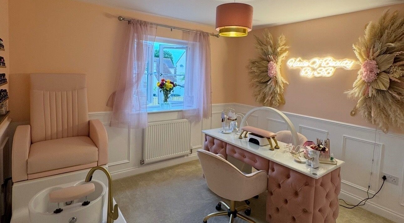Chic interior of House Of Beauty By SB in Glastonbury, England with plush furniture and ambient lighting.