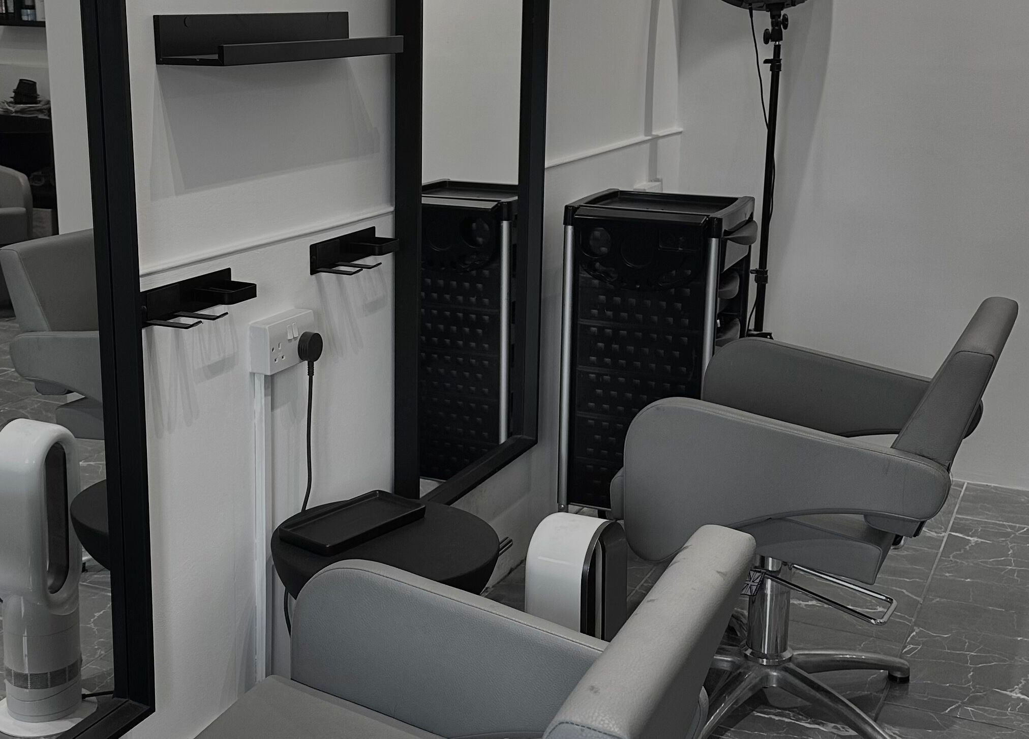 Modern salon chairs and mirrors at Hair by Tyler Alexandra in Basildon, England, GB provide a chic, welcoming space.