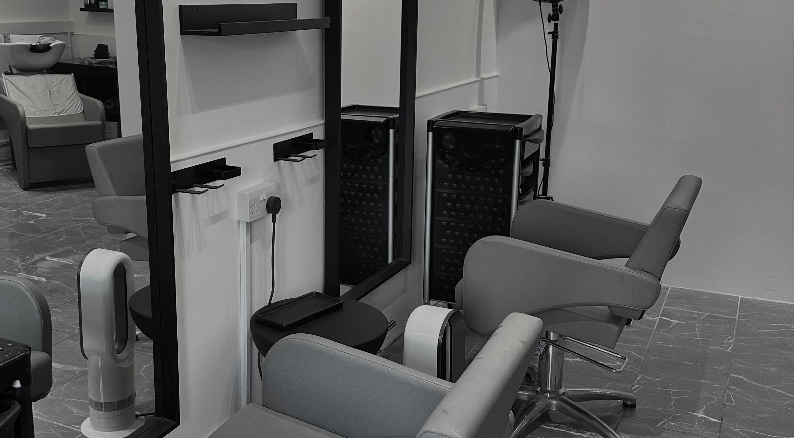 Modern salon chairs and mirrors at Hair by Tyler Alexandra in Basildon, England, GB provide a chic, welcoming space.