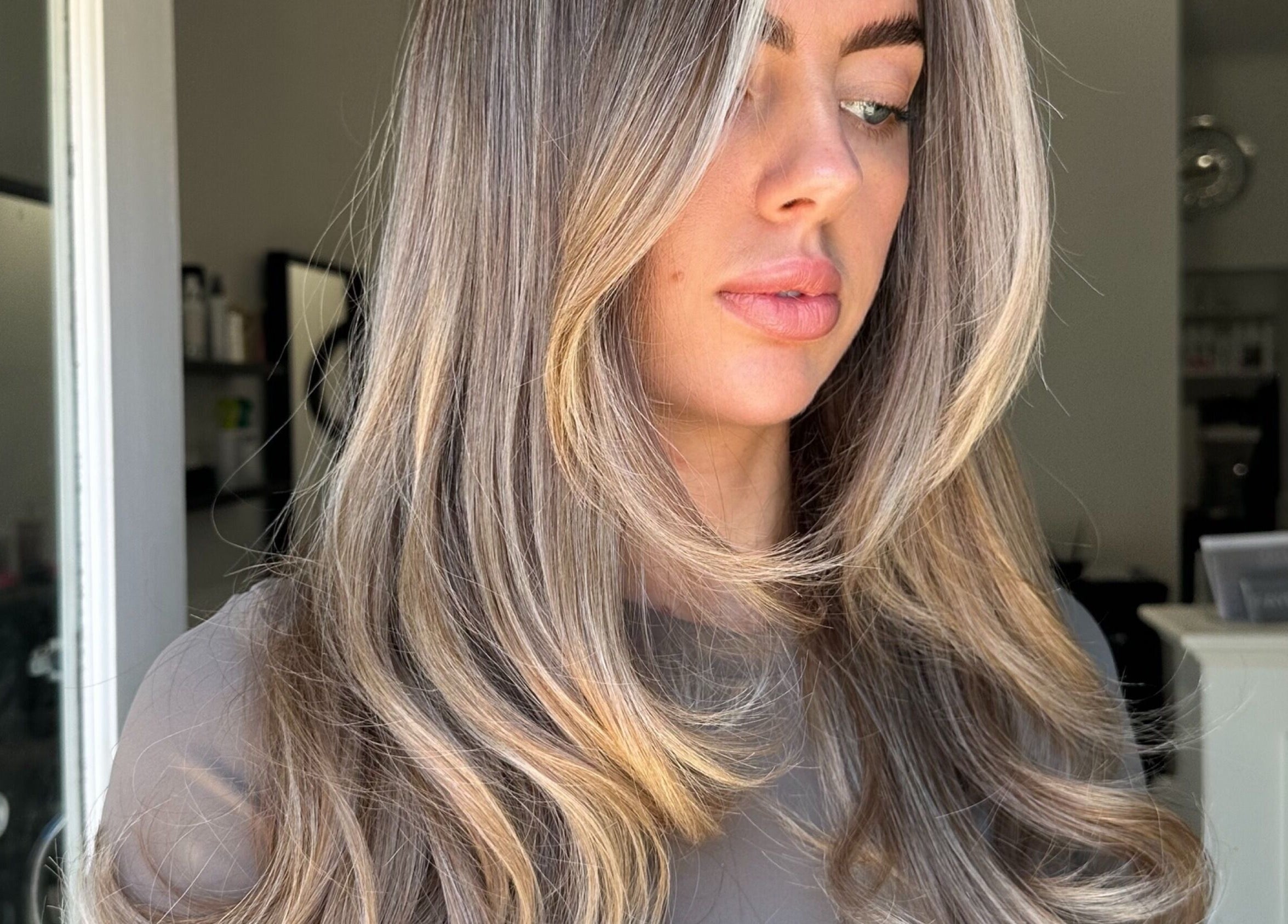 Woman with highlighted waves at Hair by Tyler Alexandra, Basildon, England, GB.