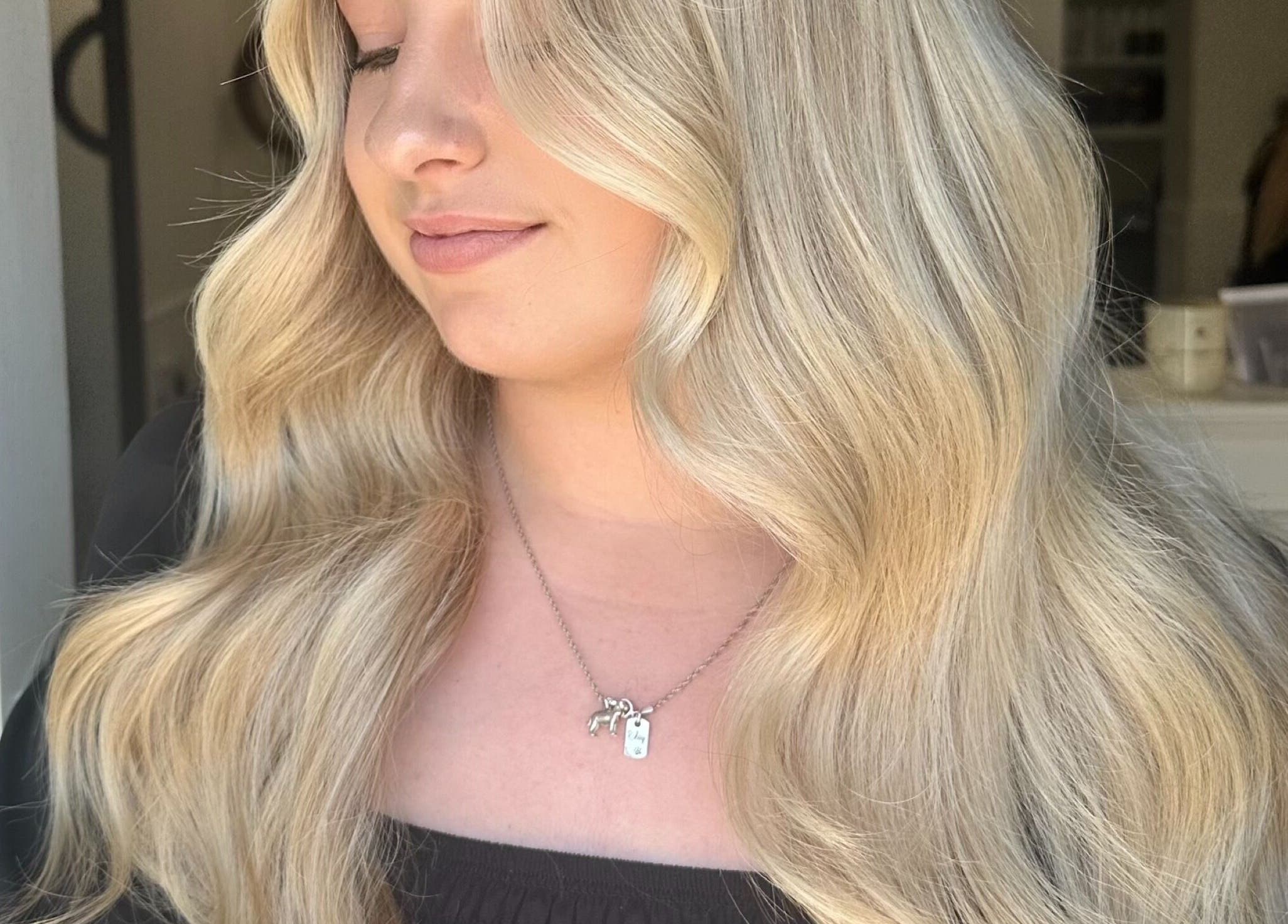 Blonde hair styled in soft waves at Hair by Tyler Alexandra, Basildon, England, GB.