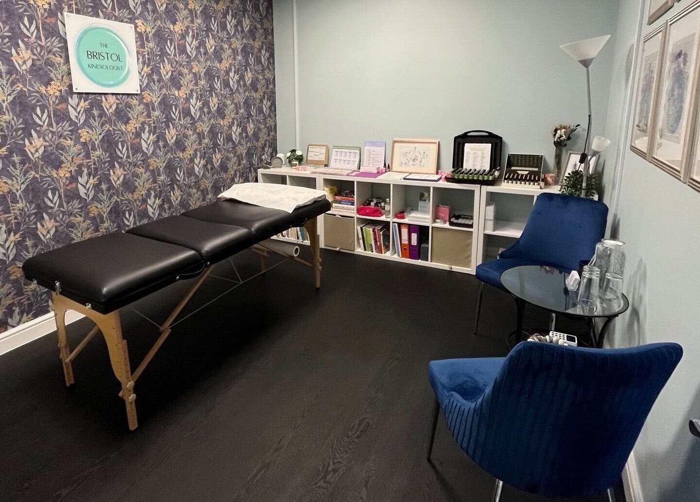 Interior view of The Bristol Kinesiologist at Emersons Green, England. A calming therapy room with a massage table.