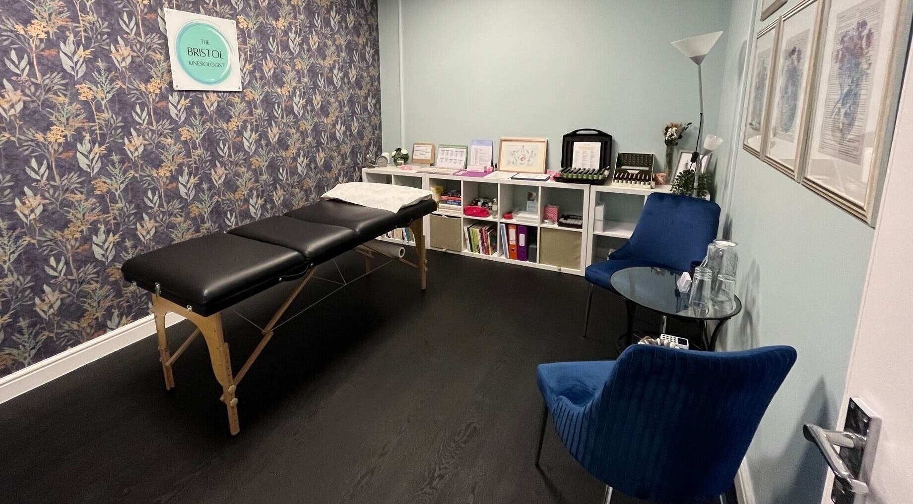 Interior view of The Bristol Kinesiologist at Emersons Green, England. A calming therapy room with a massage table.