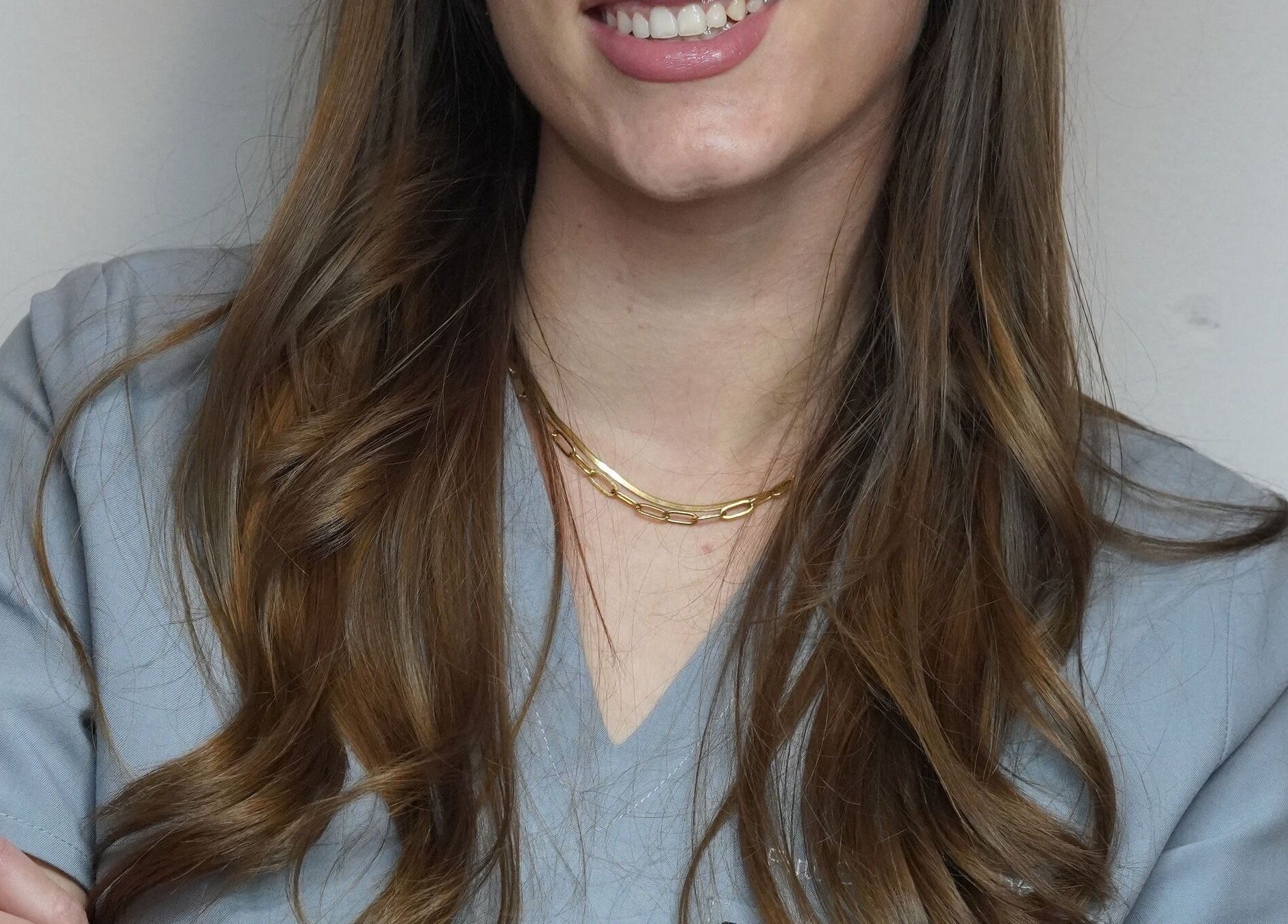 Aesthetician at Full Circle Aesthetics in Pretoria, Gauteng, ZA, smiling warmly in a beauty clinic.