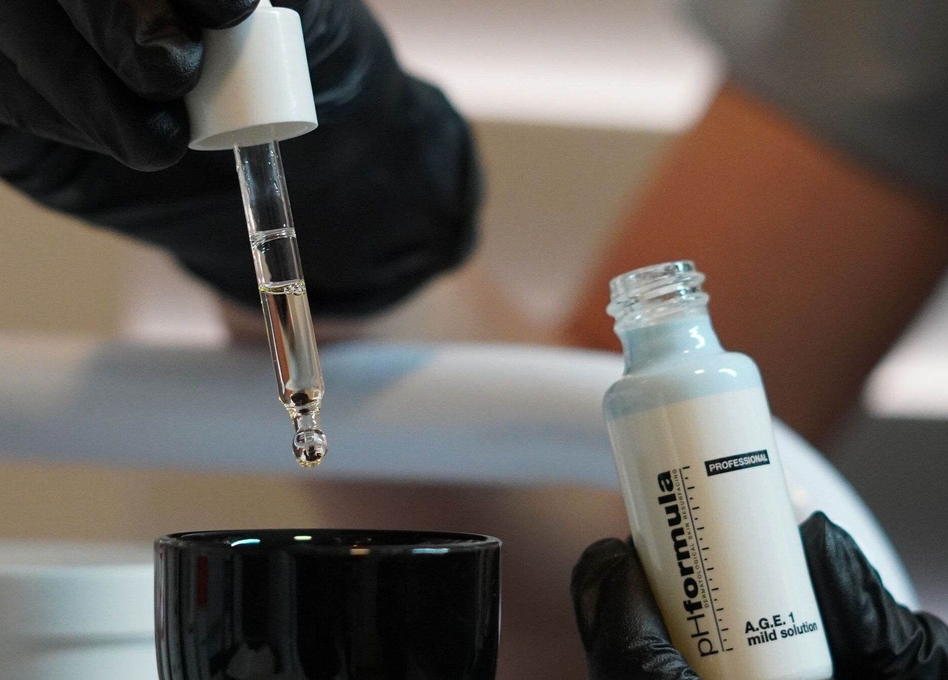 Aesthetician preparing serum at Full Circle Aesthetics, Pretoria, Gauteng, ZA.