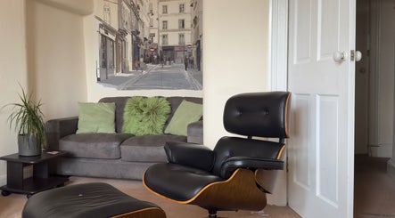 Stylish modern lounge at The Alchemist Bunny in Glasgow, Scotland, GB featuring chic chairs and cozy sofa.