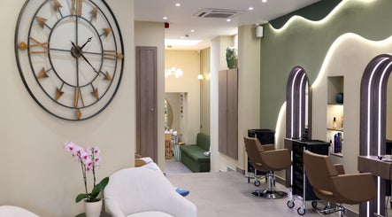 Modern interior of Marnis Salon in London, England, GB, featuring stylish chairs and decor.