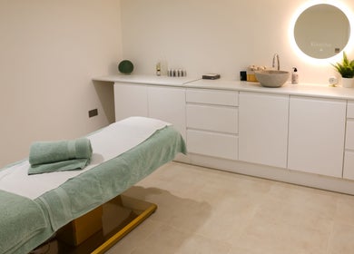 Elegant treatment room at Marnis Salon in London, England, GB, featuring relaxing ambiance and modern design.