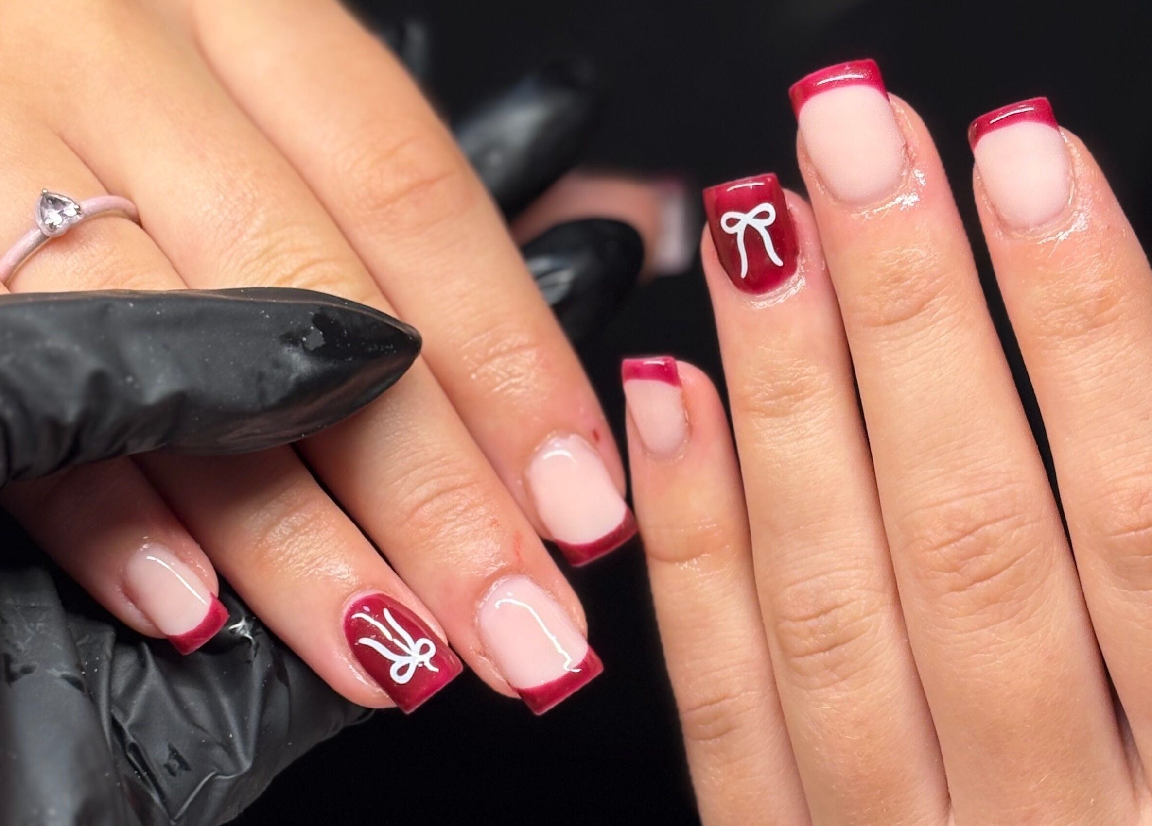 Elegant red and white nail art at Nails by Mia, Stratford-upon-Avon, England, GB. Beautifully crafted manicure.