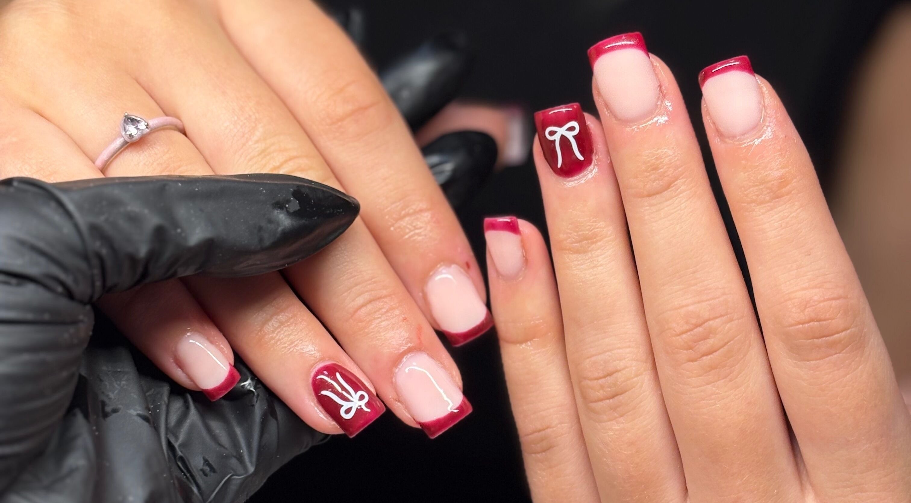 Elegant red and white nail art at Nails by Mia, Stratford-upon-Avon, England, GB. Beautifully crafted manicure.