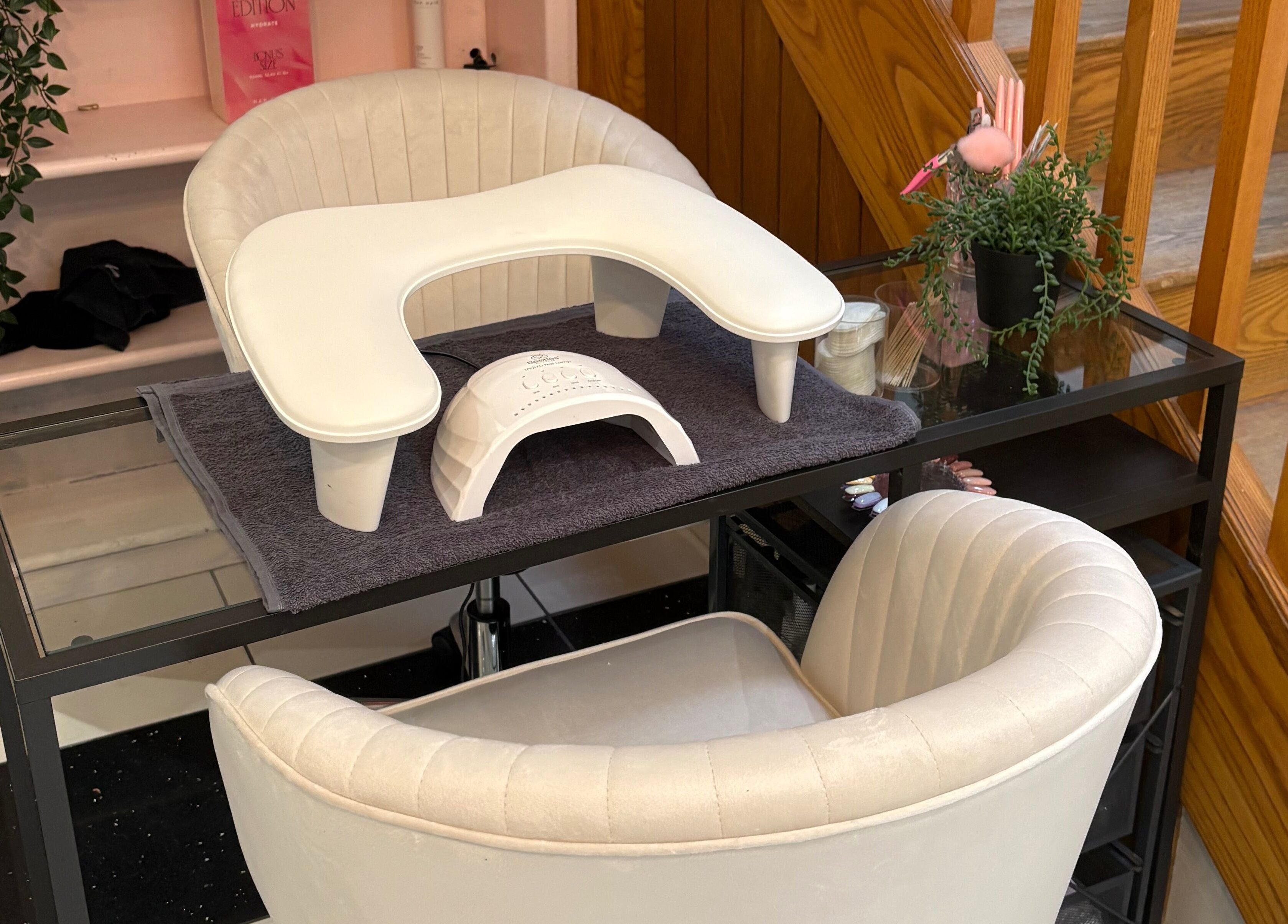 Cozy nail station at Nails by Mia, Stratford-upon-Avon, England, GB with plush chairs and manicure setup.