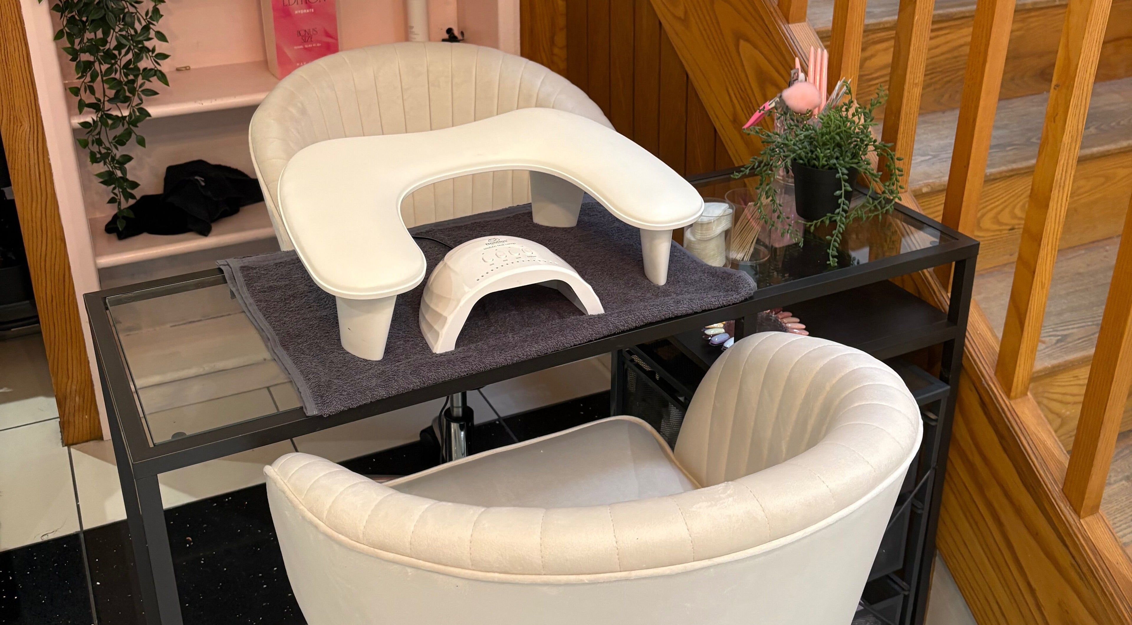 Cozy nail station at Nails by Mia, Stratford-upon-Avon, England, GB with plush chairs and manicure setup.