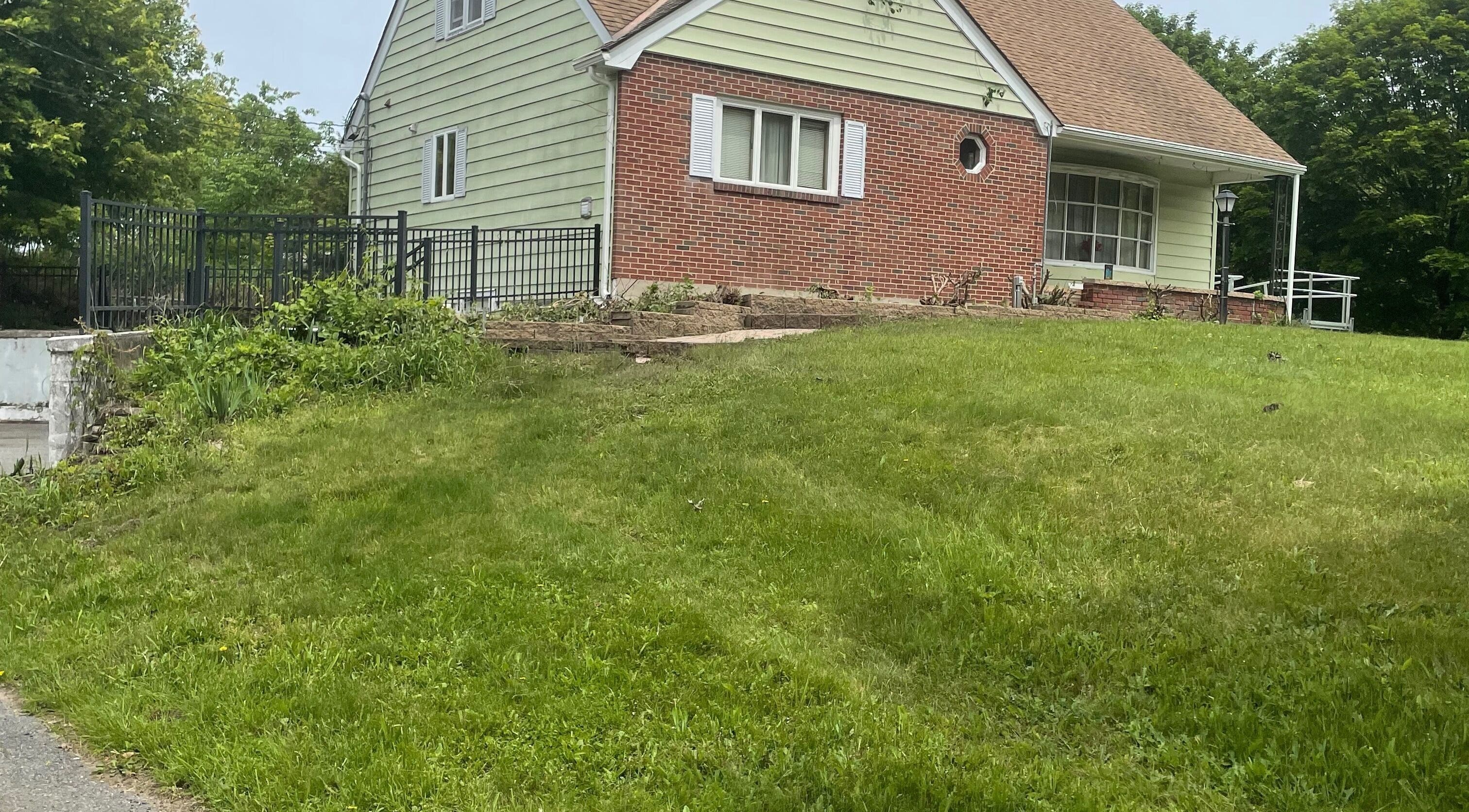 Exterior of Flawless Finish Salon in Otisville, New York, US surrounded by lush greenery.