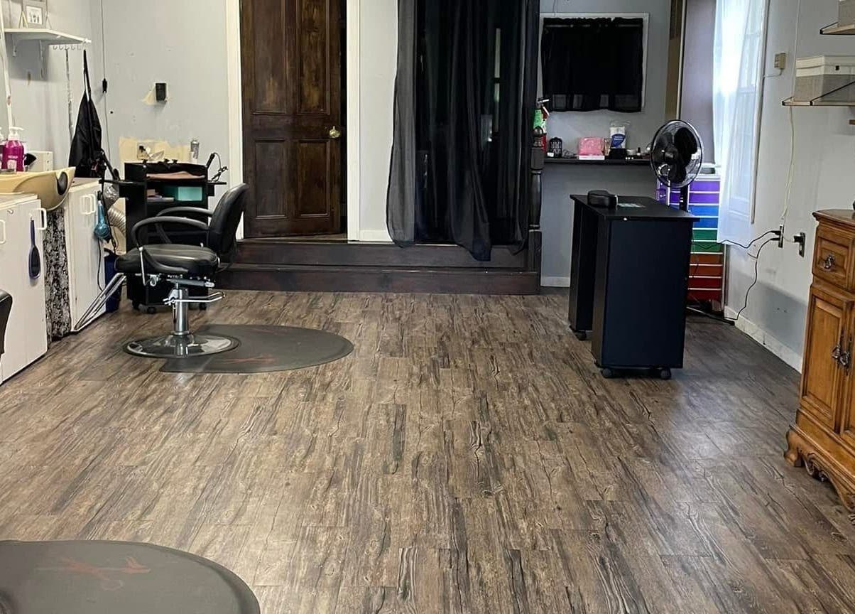 Spacious and welcoming interior of Flawless Finish Salon in Otisville, New York, showcasing modern styling chairs.