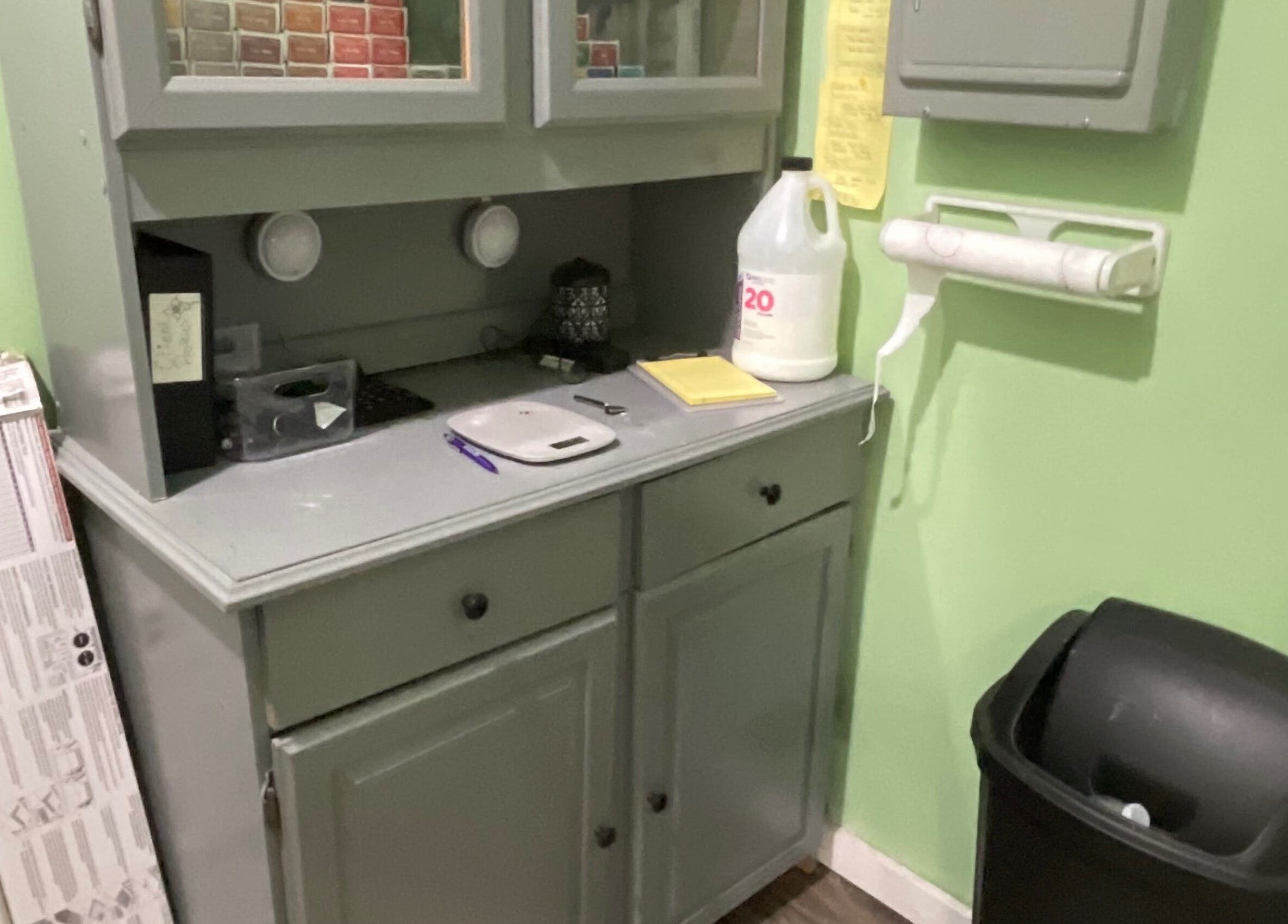Storage nook at Flawless Finish Salon in Otisville, New York, US, featuring a stylish cabinet and essentials.